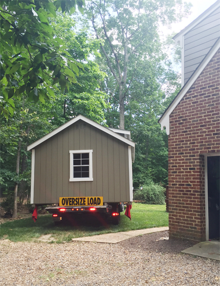 Shed-Delivery-Driving-Around-Back-Wide-Load