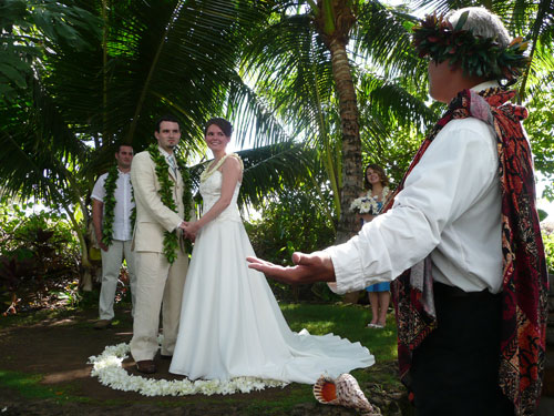 The bride and groom stood in a white orchid circle of love 