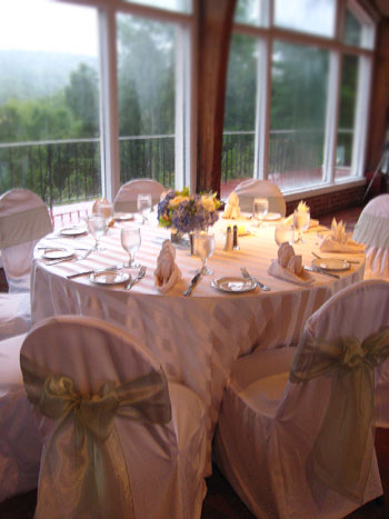  table settings consisted of sophisticated slipcovered ivory chairs and 