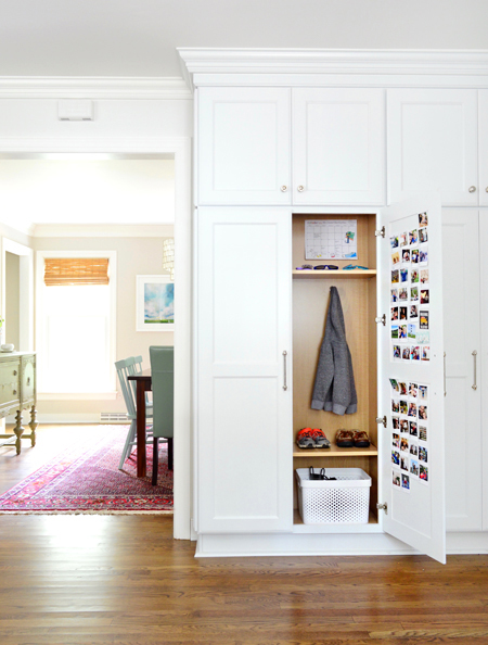 white-kitchen-remodel-hidden-mudroom-cabinet