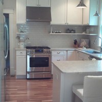 A Classic White Kitchen With Subway Tile