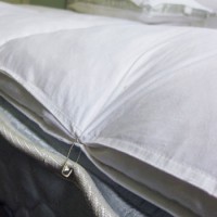 Using Safety Pins To Keep A Mattress Topper In Place
