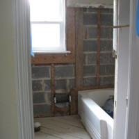 How To Demo Tile, Mortar, & Metal Mesh In Bathroom Walls