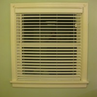Hanging Some White Faux Wood Blinds In The Bedroom