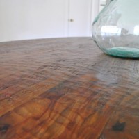 A Round Wood Pedestal Dining Table