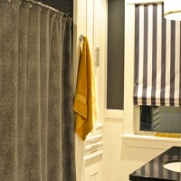 A Bathroom Makeover With Dark Gray Tile