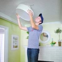 A Flush Mounted Light Near The Fireplace