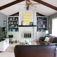 A Painted White Brick Fireplace In A Vaulted Living Room