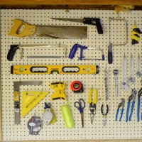 Organizing Tools With A Pegboard & Nails With Glass Jars