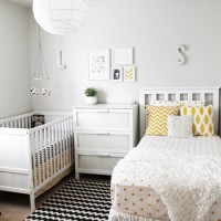 A Shared Nursery With A Crib & A Bed