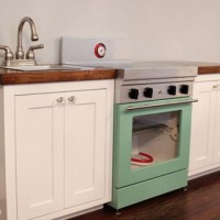 A Cute Play Kitchen With Light-Up Burners