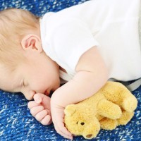 DIY Newborn Photo Shoot With Infant Boy On Blue Blanket With Bear