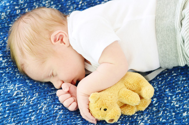 DIY Newborn Photo Shoot With Infant Boy On Blue Blanket With Bear