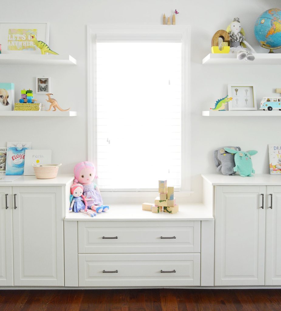 Built In Cabinets Under Window With Floating Shelves In Playroom