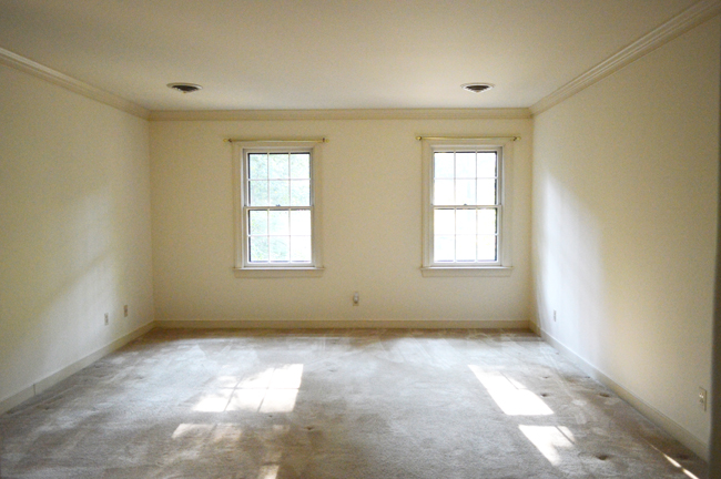 Before Photo Of Upstairs Main Bedroom With Carpet and White Walls