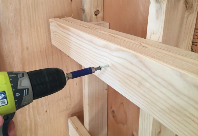 shed storage ideas screwing temporary boards for heavy duty shelves