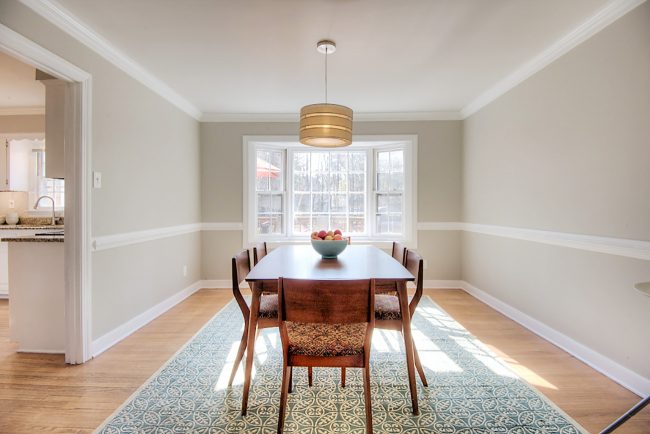 living room staged to sell with neutral walls and simple table