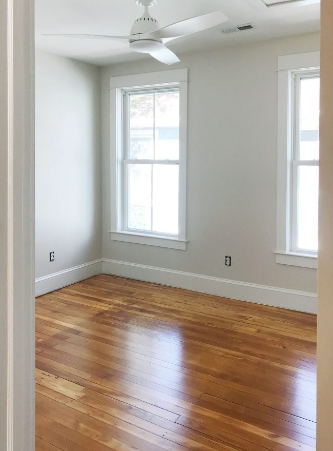 refinished pine floors upstairs bedroom white fan