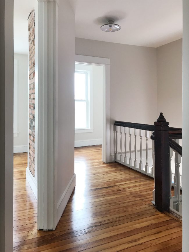 upstairs landing in beach house with refinished pine floors