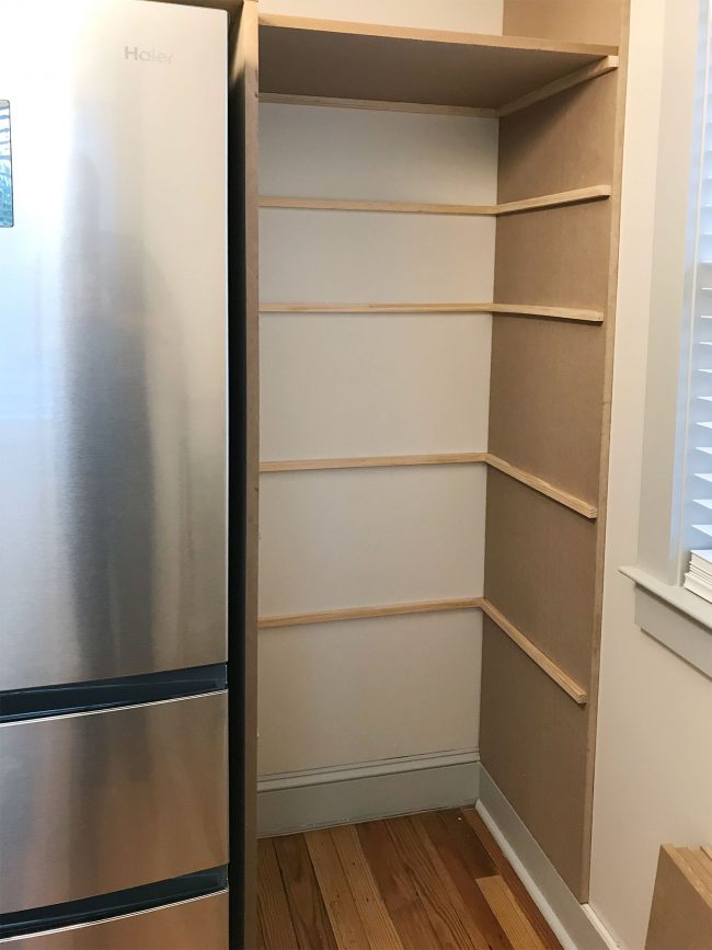 thin brace pieces added where pantry shelves will rest