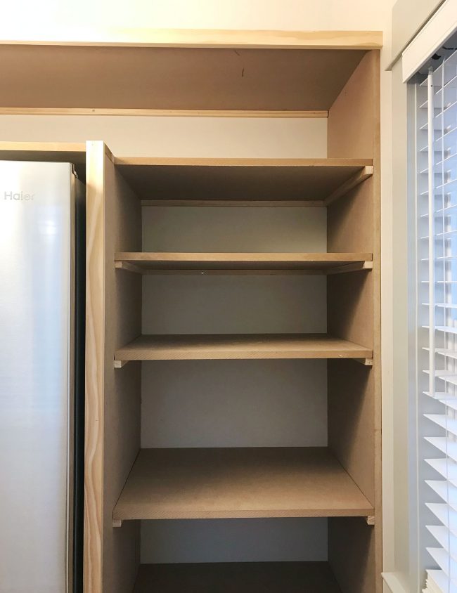 pantry shelves added on side of walk-in pantry