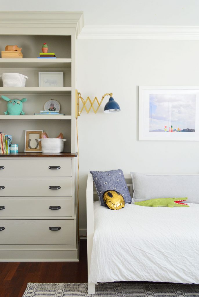 Floor to ceiling built-in bookshelf in boys bedroom