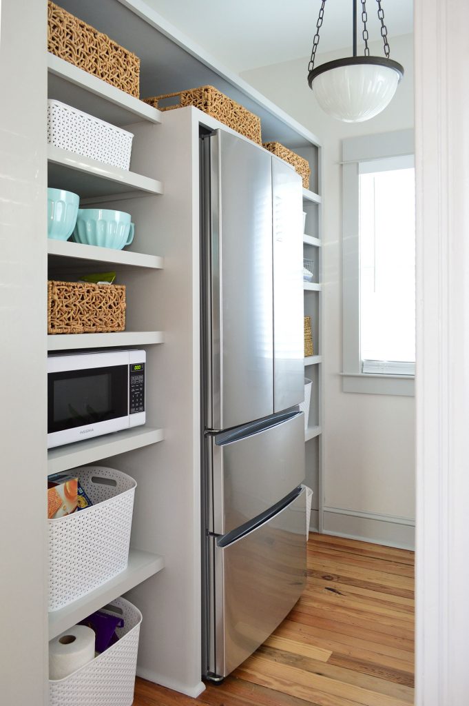 DIY pantry shelves built around a refrigerator