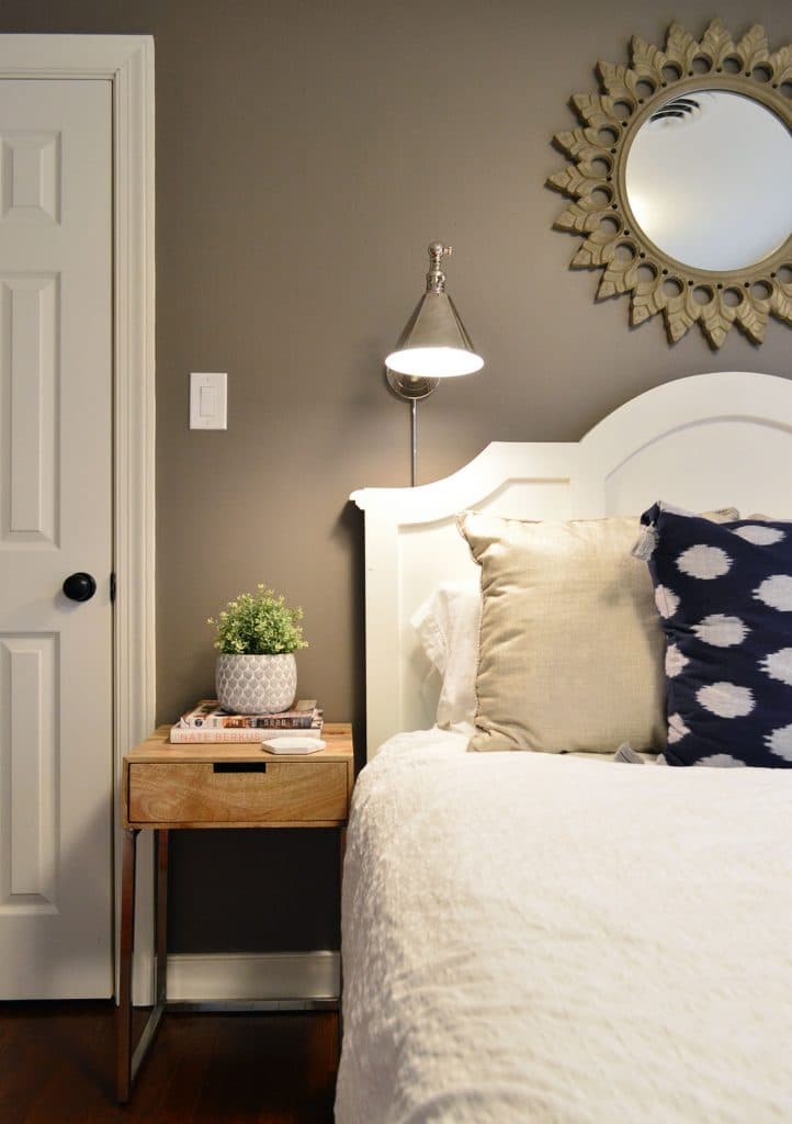 Faux ikea greenery on side table in guest room