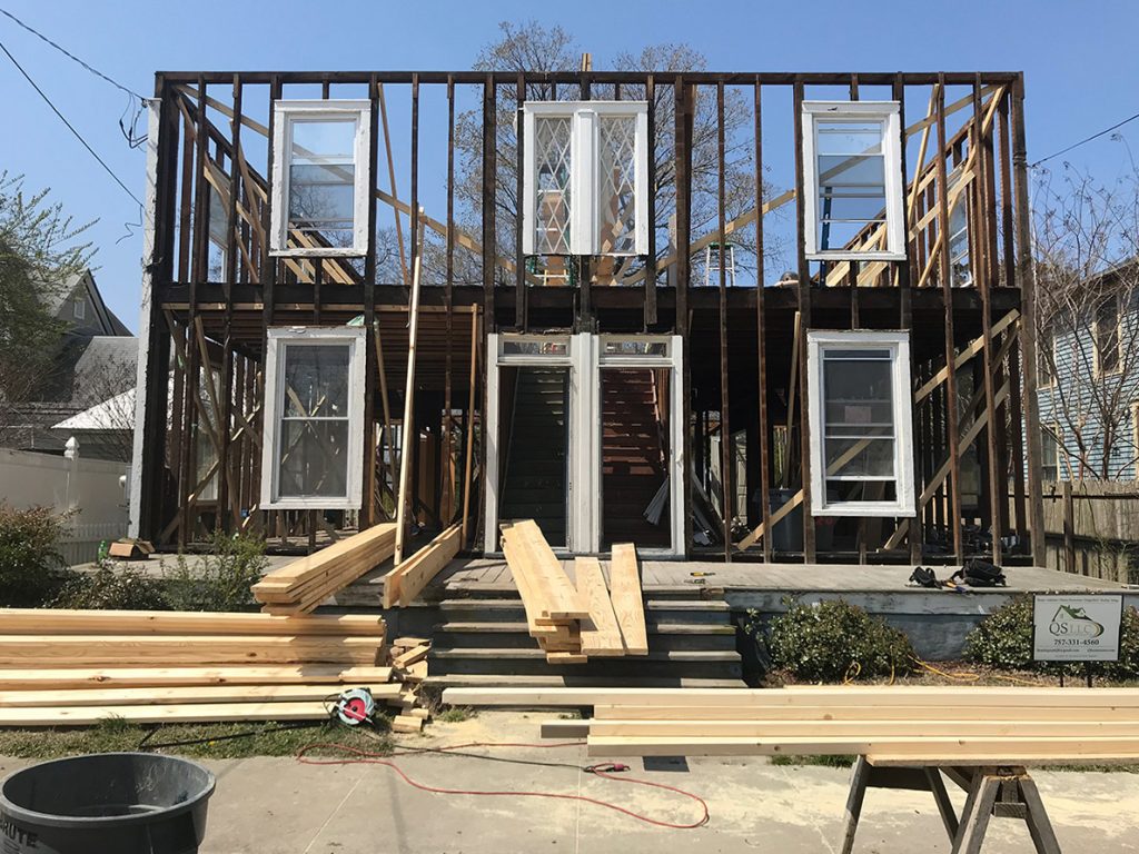 Duplex renovation photos of home stripped to framing