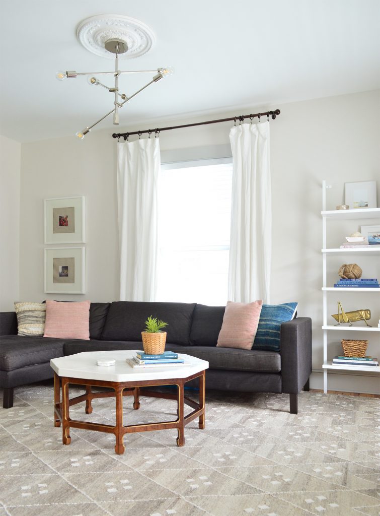 neutral living room with dark charcoal ikea sectional