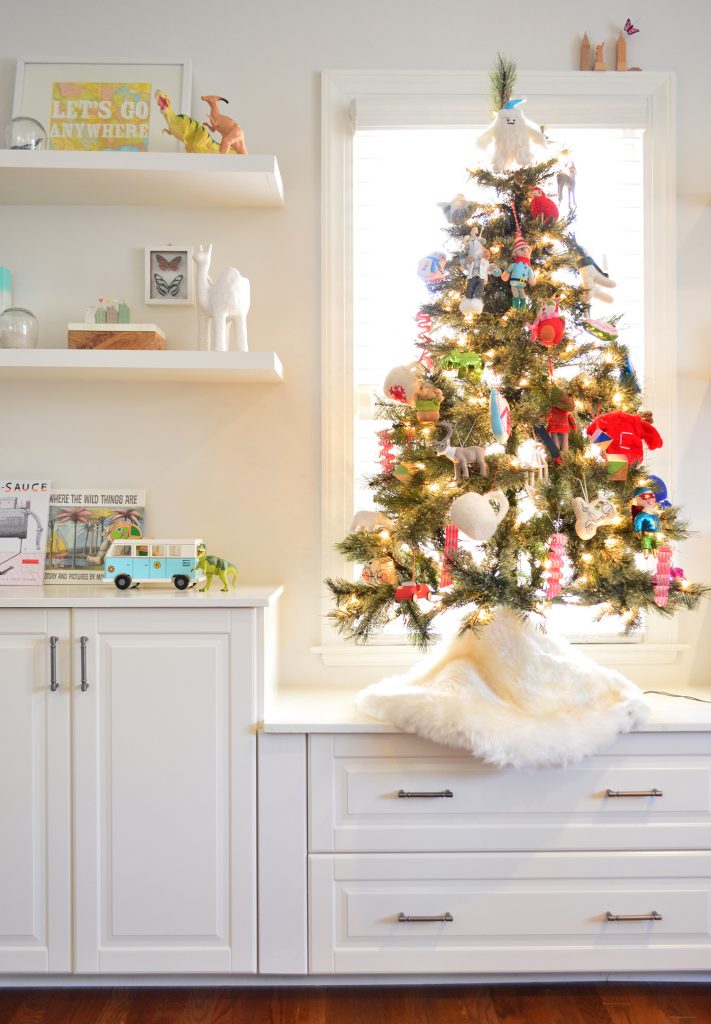 Artificial Tabletop Christmas Tree Next To Kids Toy Shelves