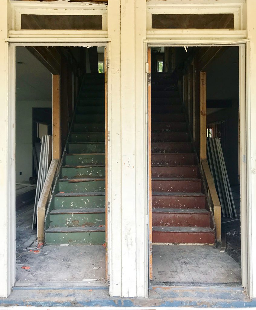 Before Photo Of Both Duplex Doors Open Side-by-Side With Rotting Wood