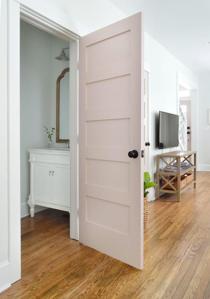 First Floor Powder Room With Pink Door