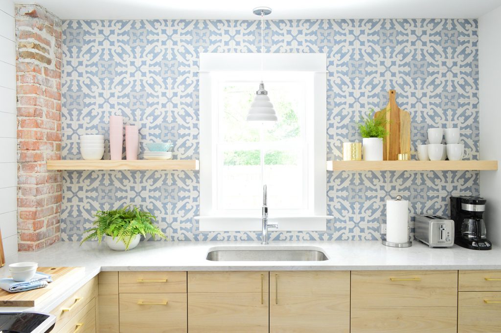 Blue Tile Backsplash With Wood Floating Shelves In Kitchen