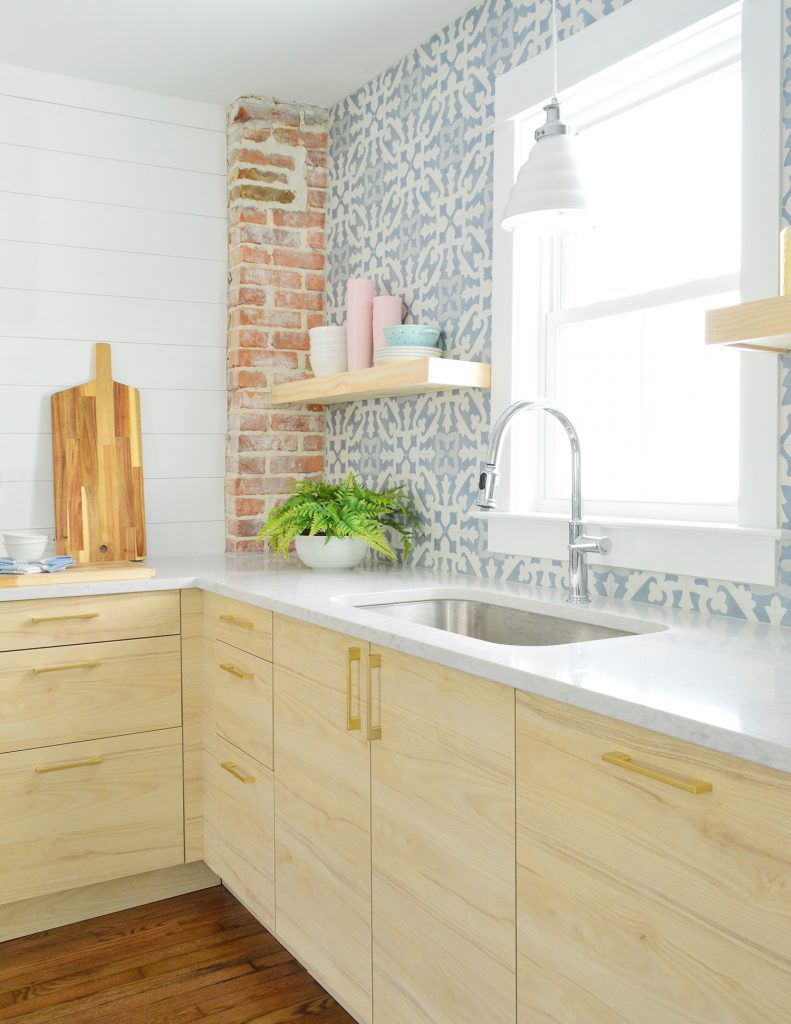 Duplex Kitchen With Blue Tile And Wood Open Shelves And Chimney