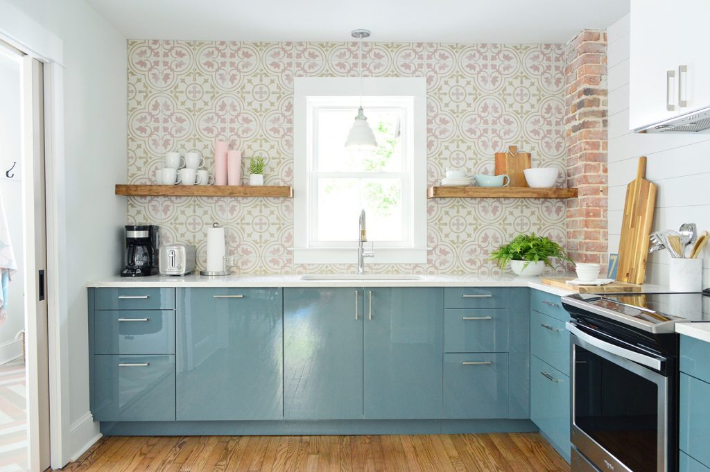 Duplex Kitchen With Blue Cabinets And Pink Patterned Backsplash