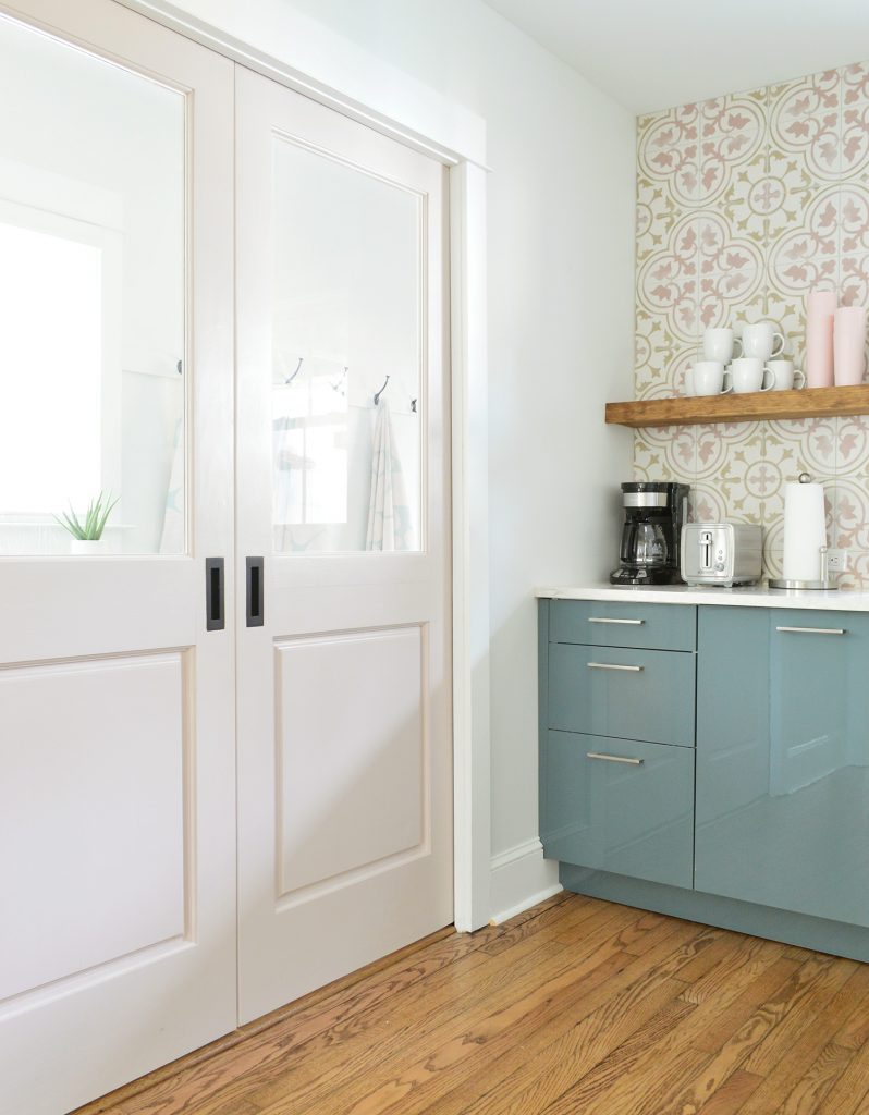 Pink Pocket Doors Between Duplex Kitchen And Mudroom