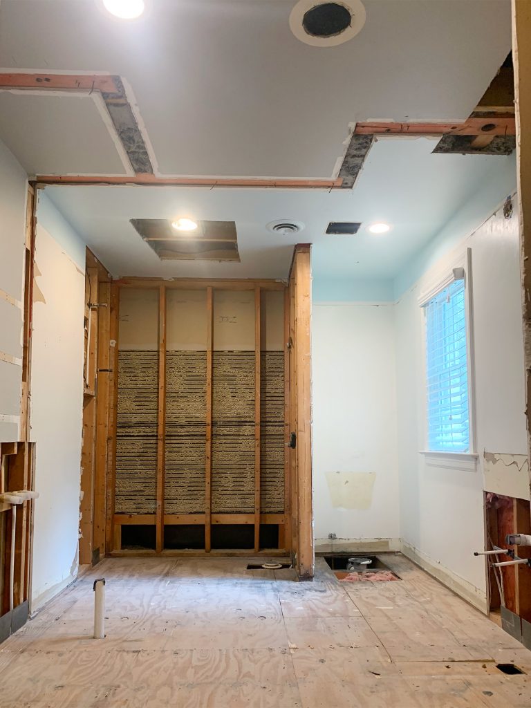 Demo Progress Photo Of Bathroom With Walls Down Exposing Whole Space