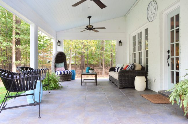 Open Back Porch With Vaulted Blue Ceiling And Tiled Floor