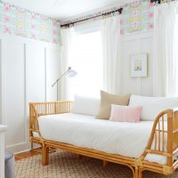 A Beach House Bedroom With Wallpaper And Board & Batten