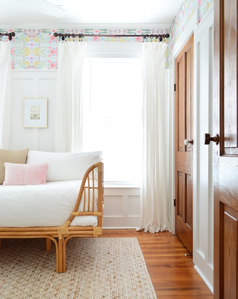 Bedroom With Wood Doors And Peel And Stick Wallpaper With Rattan Daybed