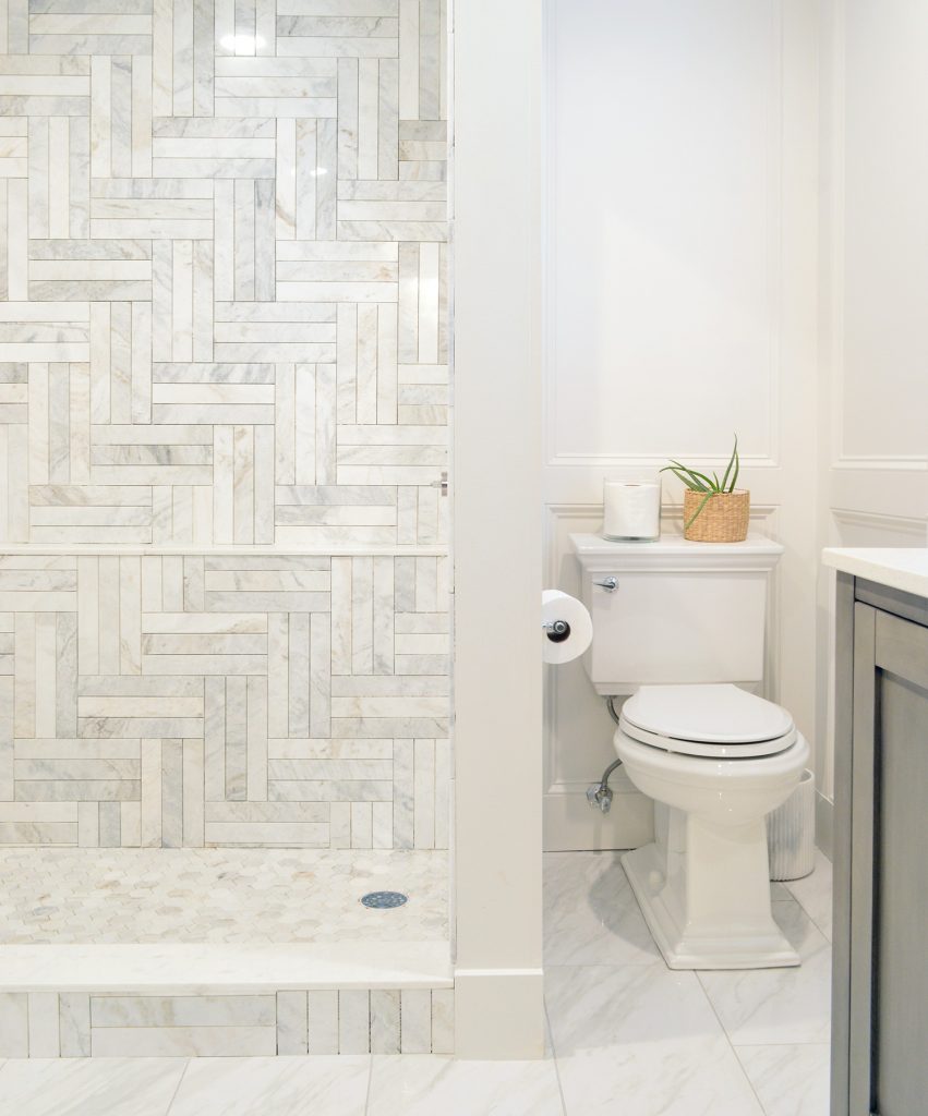 Master Bathroom Update With Toilet Installed With Ungrouted Marble Shower