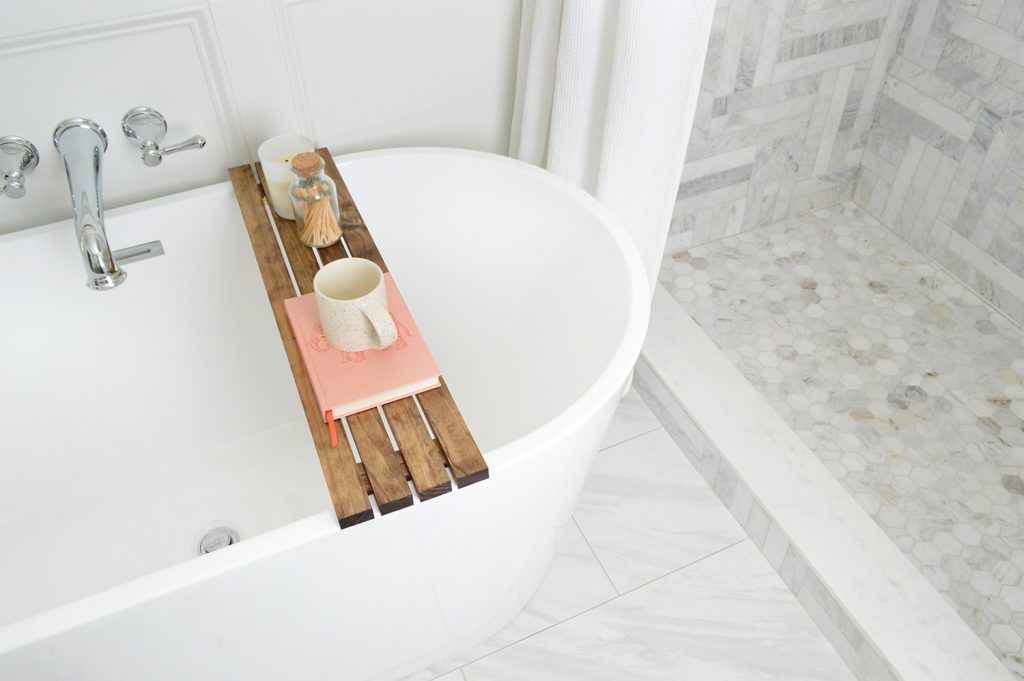 Overhead view of bathtub in marble bathroom