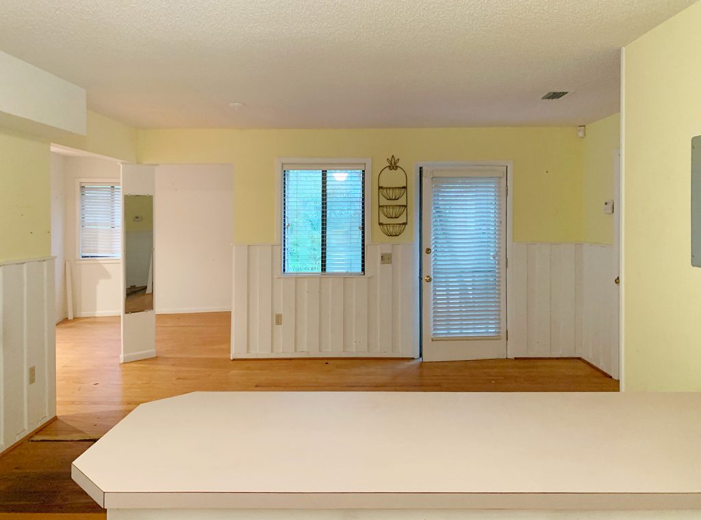 Before photo of kitchen with yellow walls into bedroom