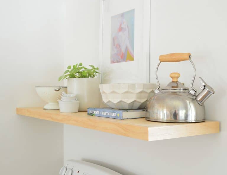 Detail Of Wood Floating Pine Shelf In Kitchen With Tea Kettle