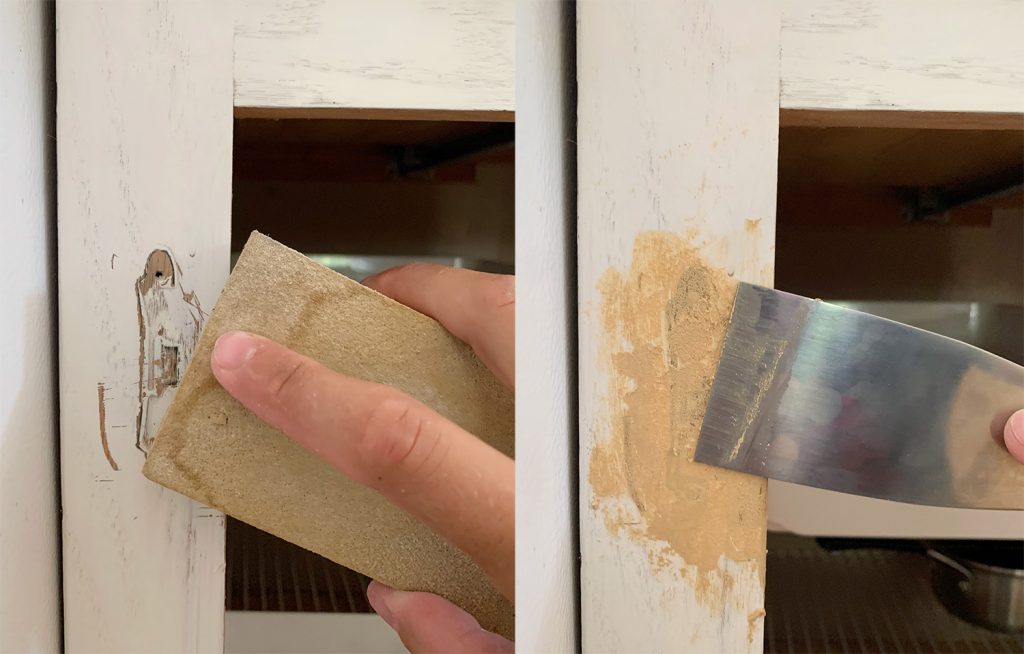 Sanding and scraping wood filler onto cabinet frame to cover hinge holes