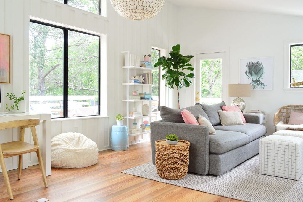 Wide Shot of Upstairs Living Room With Big Windows To Trees