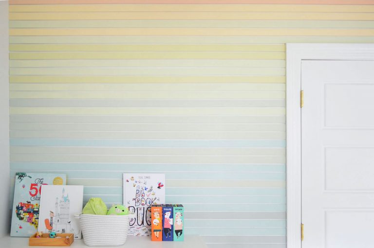 Wide View Of Colorful Stripe Wall Treatment Going Around Bookcase And Closet Door