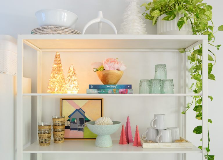 White Metal Kitchen Shelves With Lighted And Colorful Christmas Trees