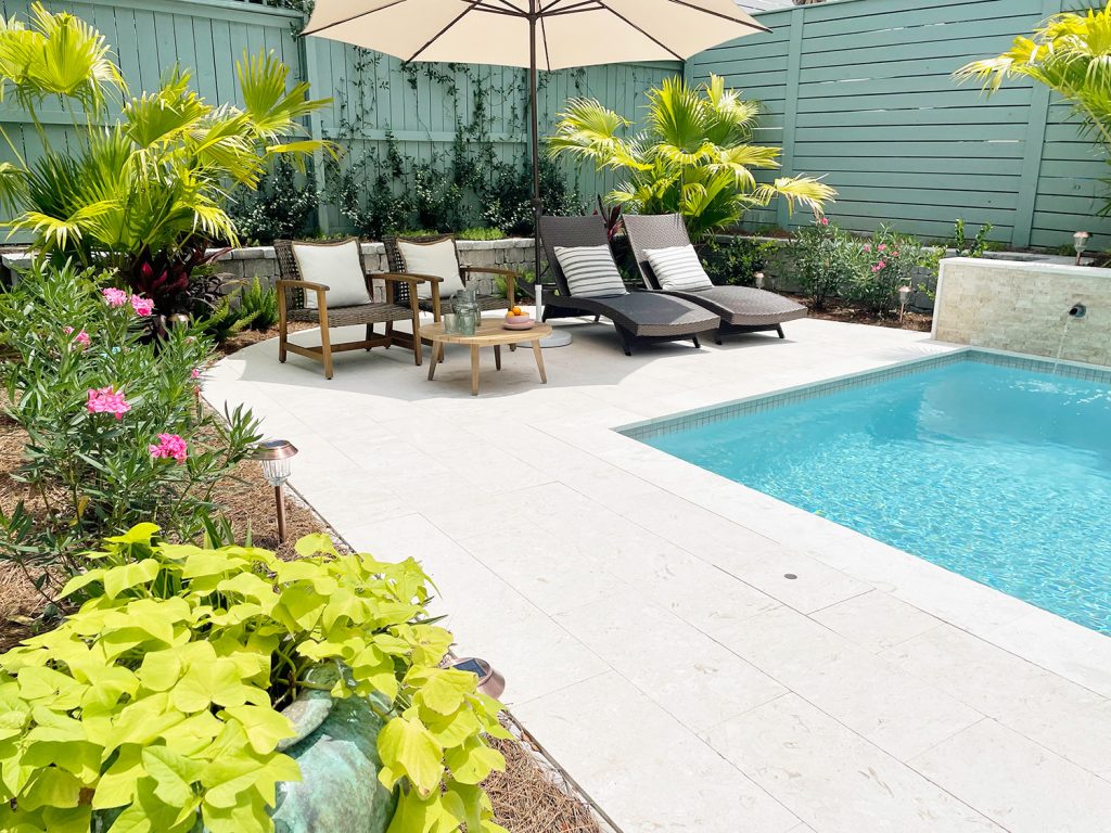 After photo of yard with small tropical pool and new plantings